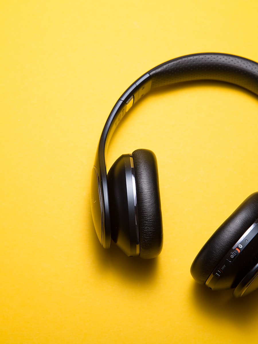 Black headphones on a yellow background