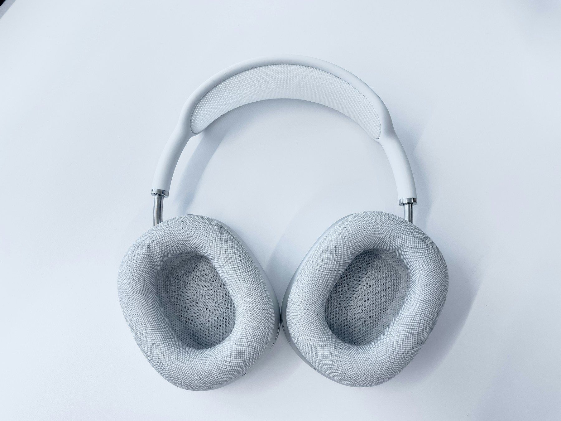 White AirPods Max headphones on a white background