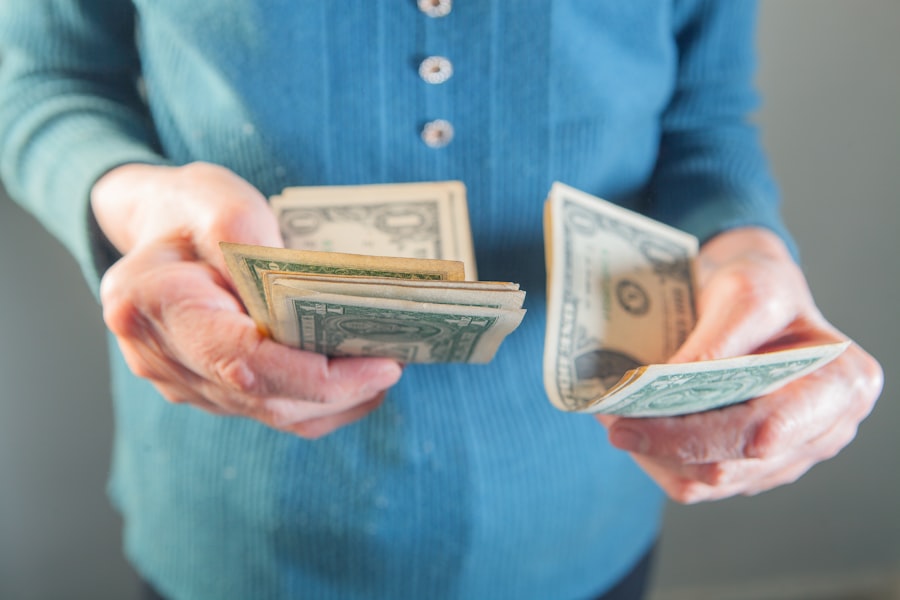 Hands holding a fan of US dollar bills